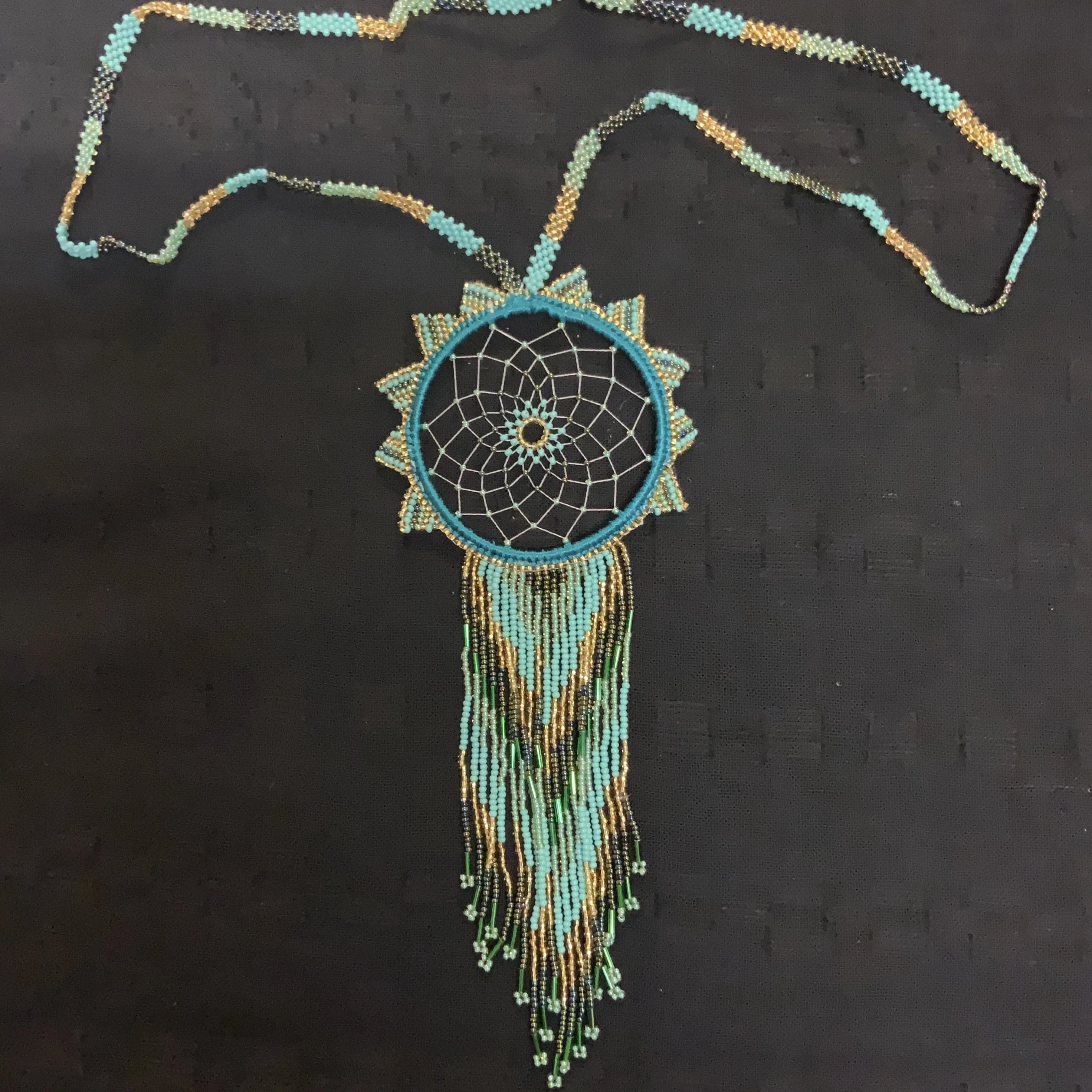 Guatemalan handcrafted beaded dream catcher necklace. 28” neck, 10 inch pendant drop.