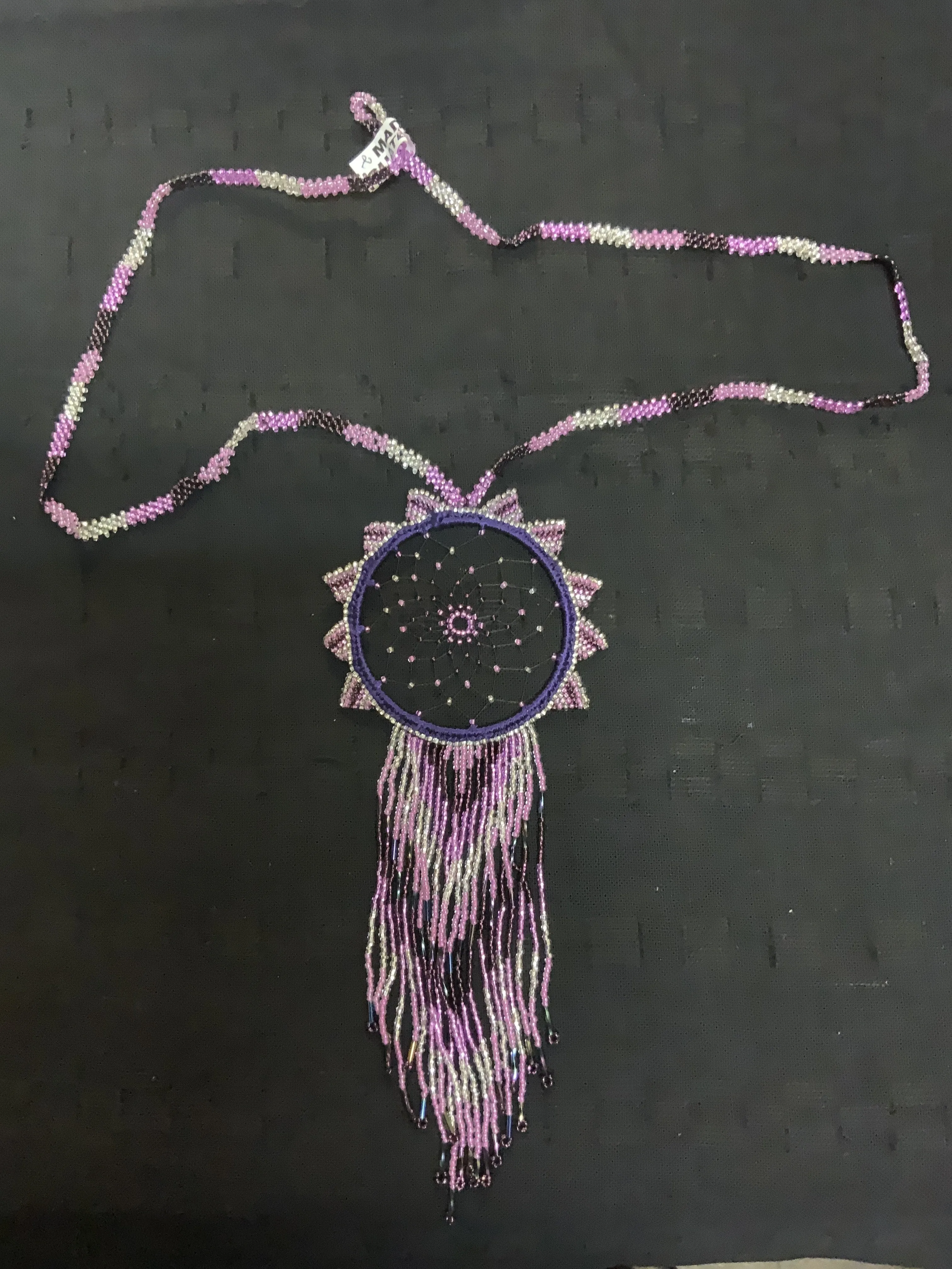 Guatemalan handcrafted beaded dream catcher necklace. 28” neck, 10 inch pendant drop.