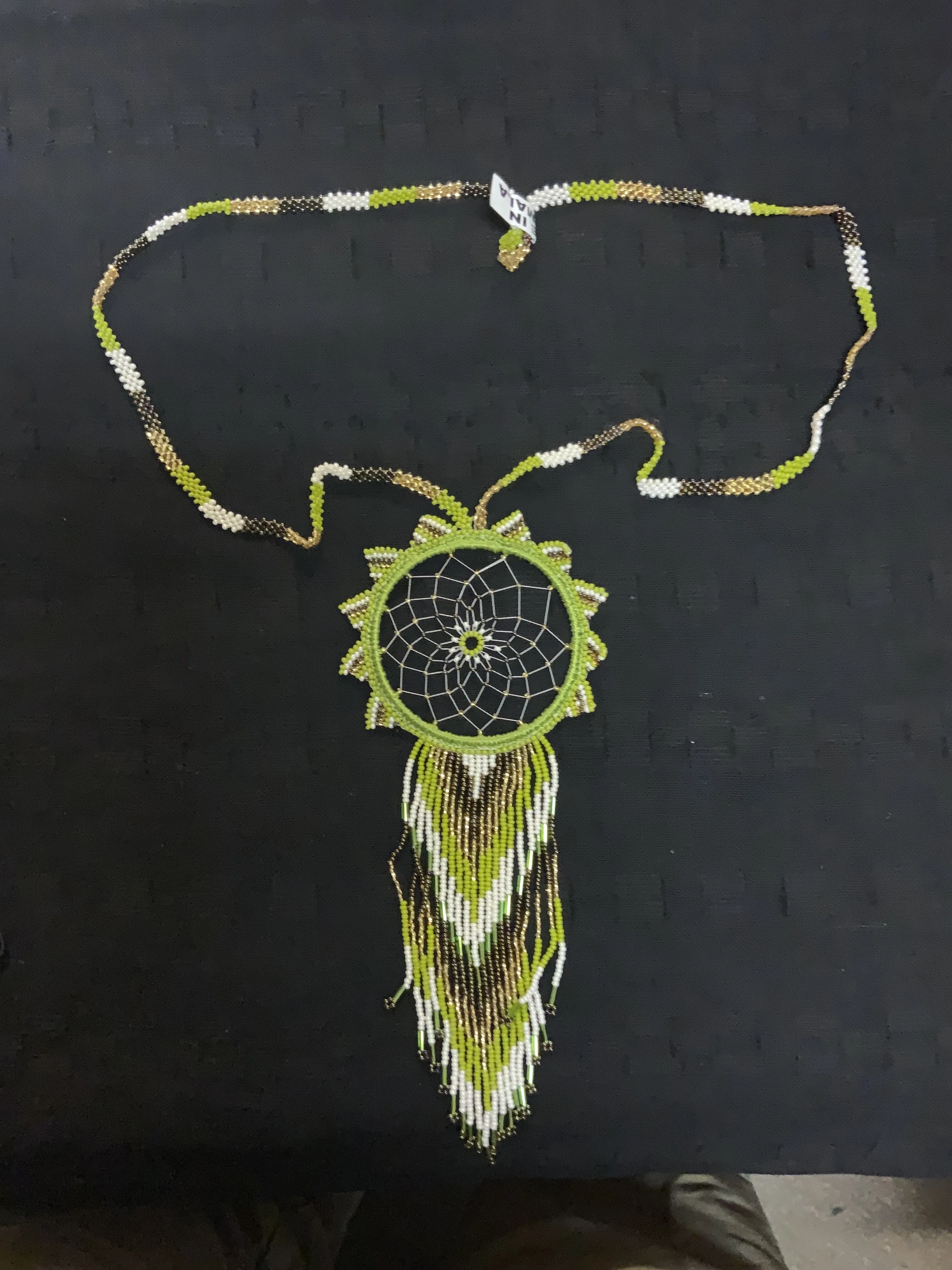 Guatemalan handcrafted beaded dream catcher necklace. 28” neck, 10 inch pendant drop.