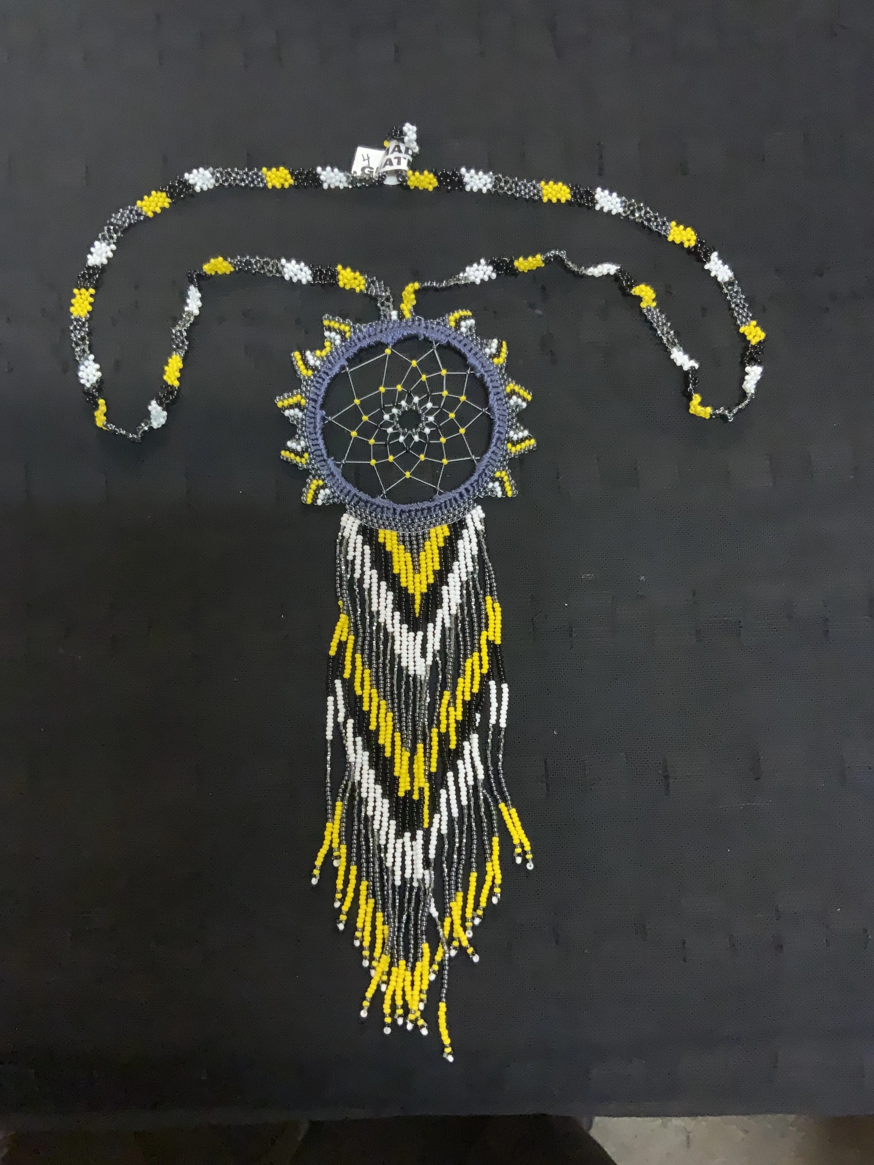 Guatemalan handcrafted beaded dream catcher necklace. 28” neck, 10 inch pendant drop.