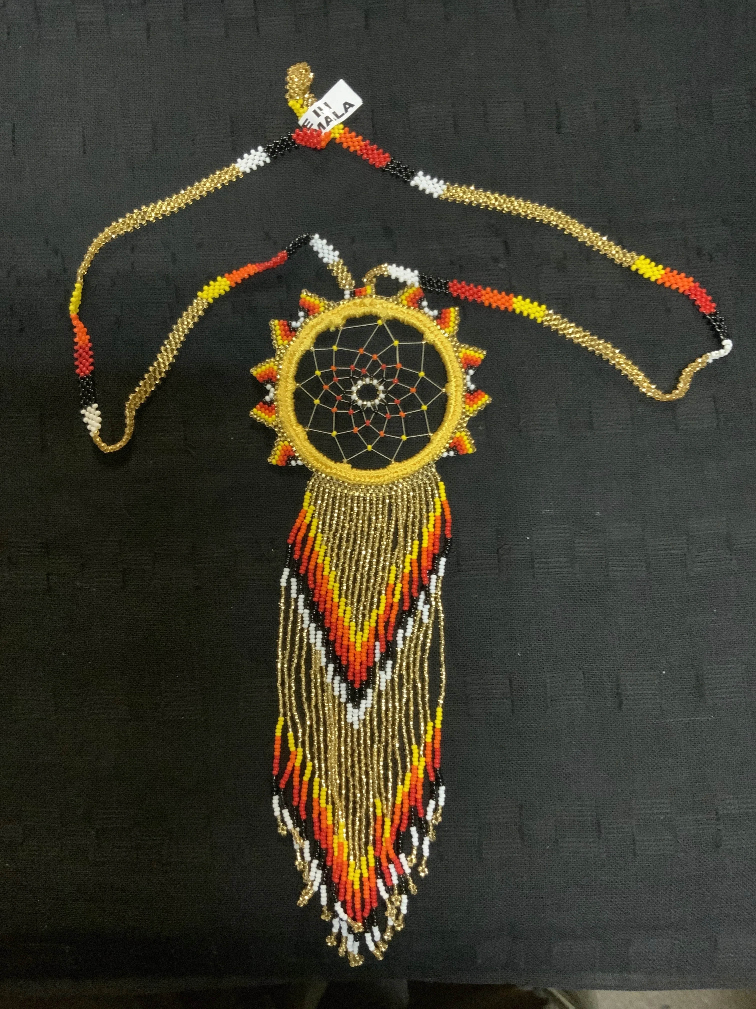 Guatemalan handcrafted beaded dream catcher necklace. 28” neck, 10 inch pendant drop.