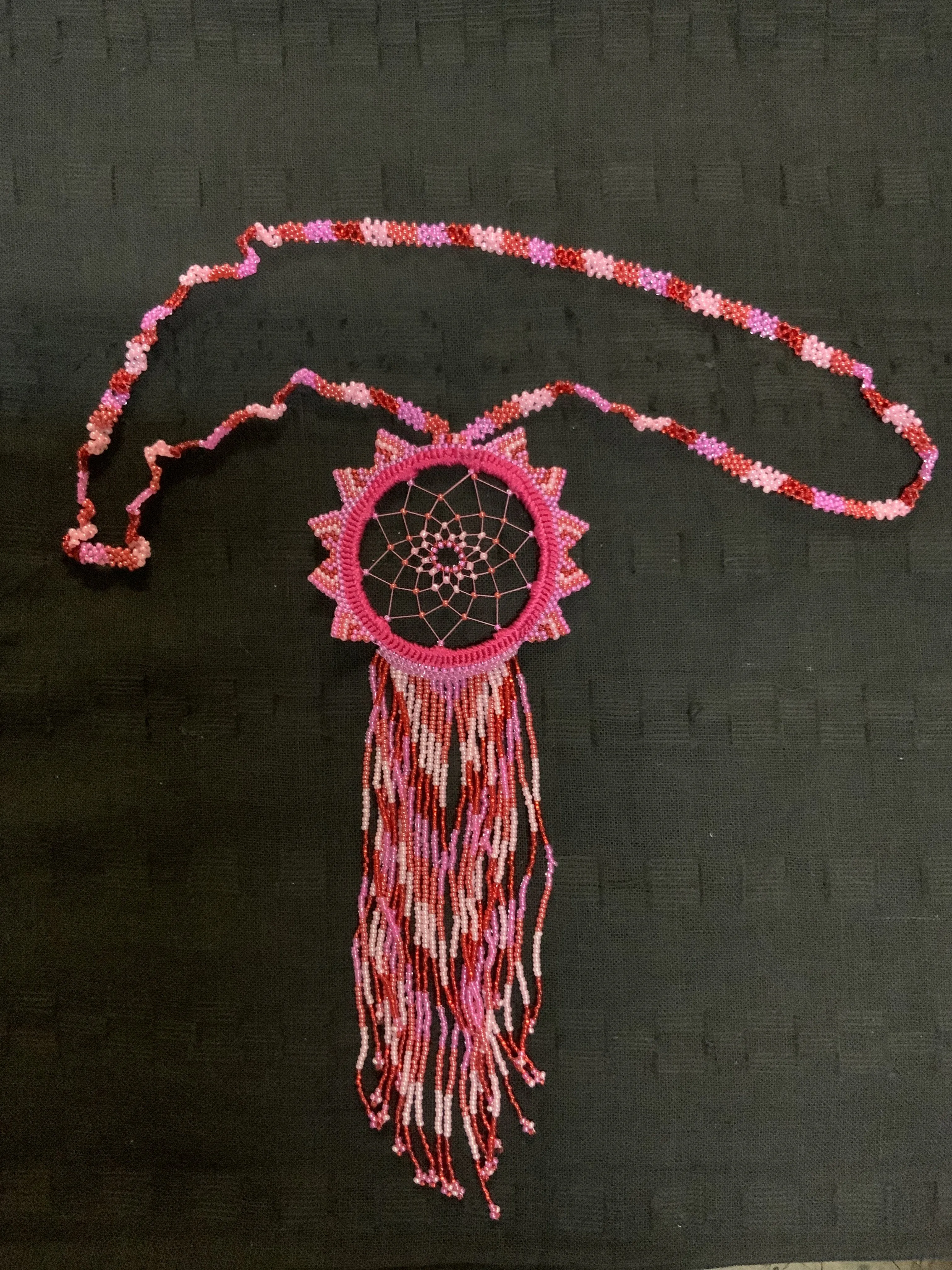 Guatemalan handcrafted beaded dream catcher necklace. 28” neck, 10 inch pendant drop.