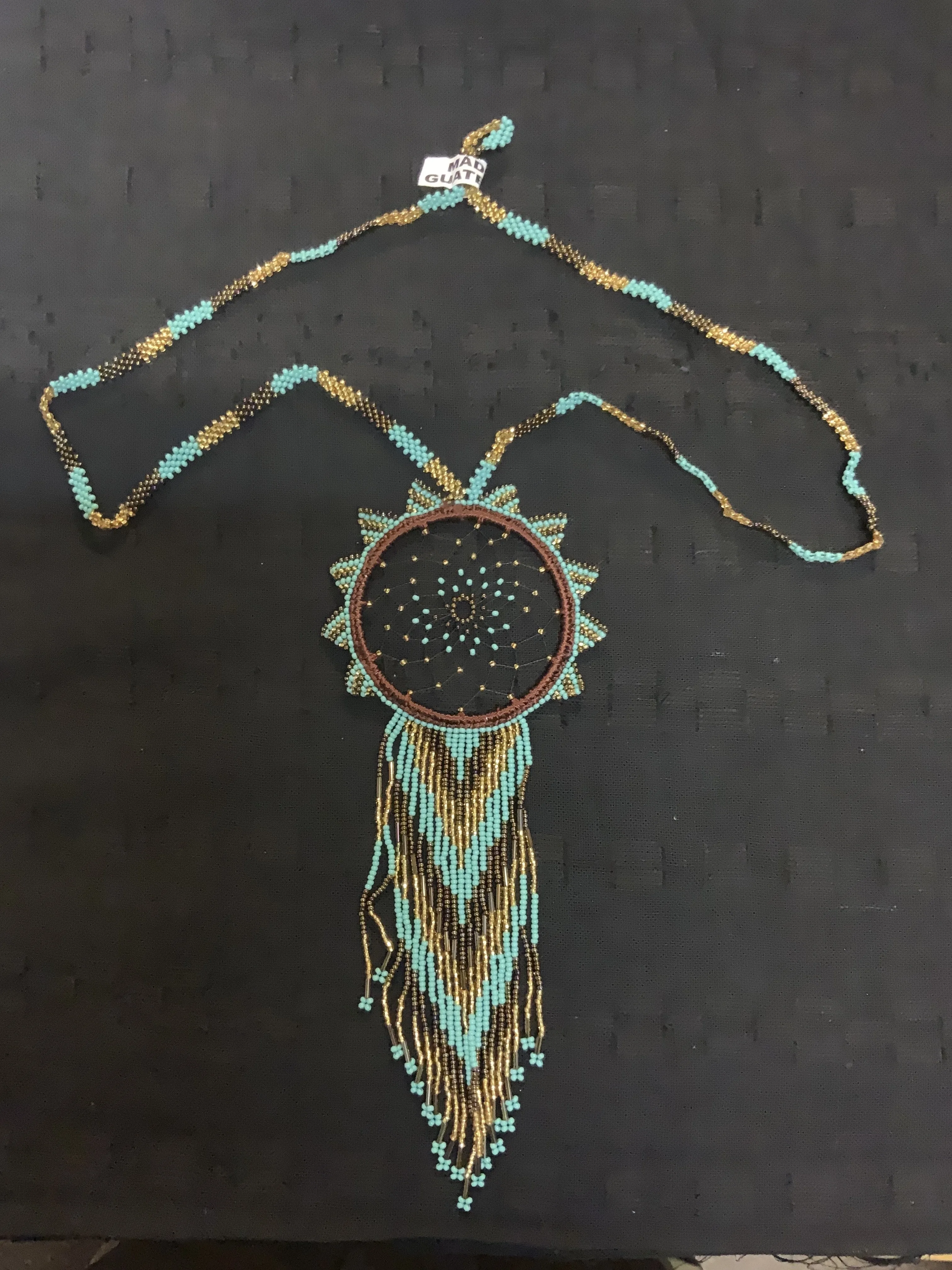 Guatemalan handcrafted beaded dream catcher necklace. 28” neck, 10 inch pendant drop.