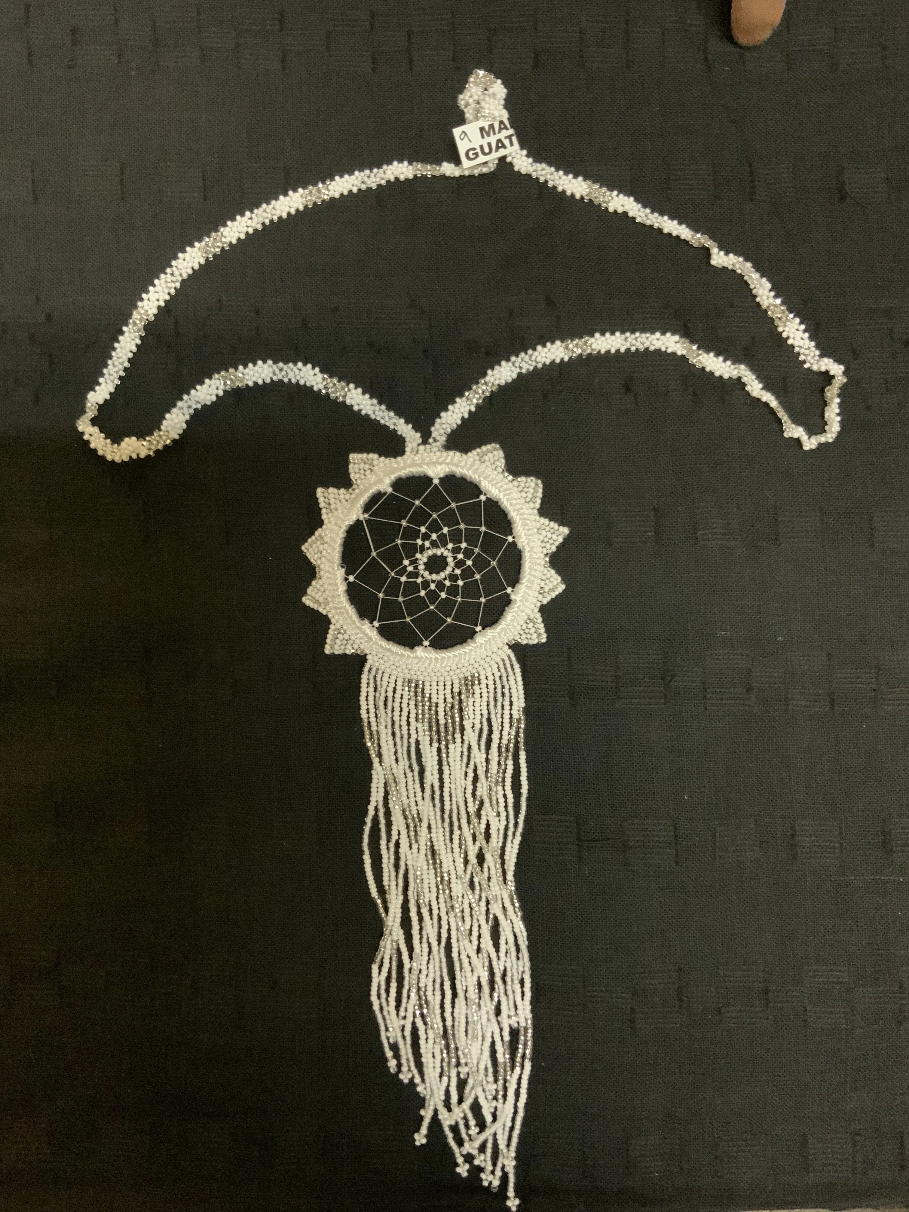 Guatemalan handcrafted beaded dream catcher necklace. 28” neck, 10 inch pendant drop.