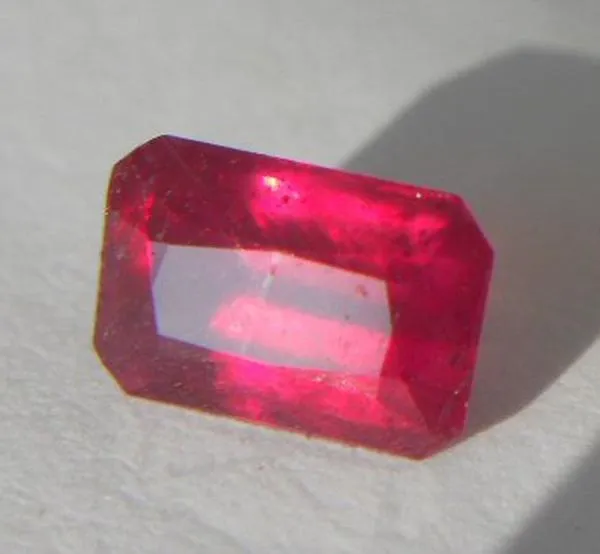 RUBY ,EMERALD CUT BRIGHT RED 1.48CTS. 7MM. X 4MM.