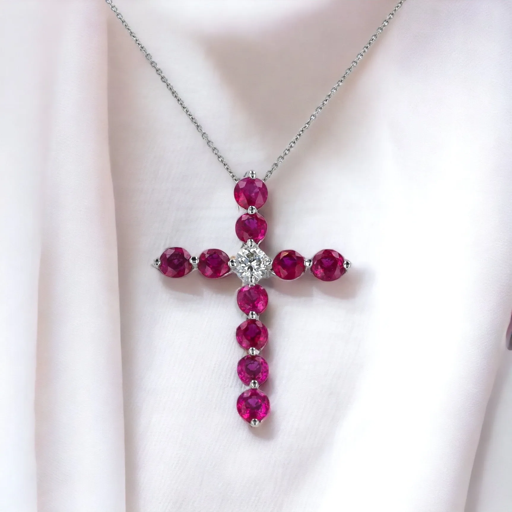 White 14k gold red ruby one center diamond cross necklace